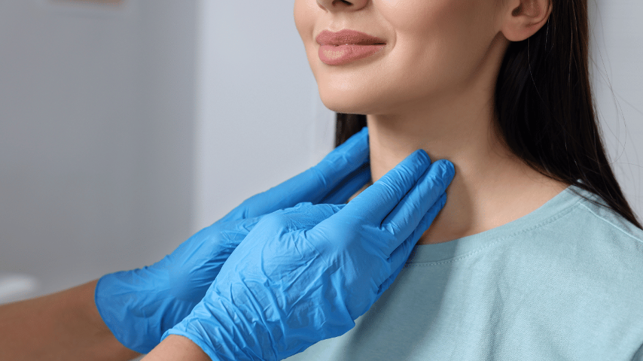 Summit Health endocrinologist examining a woman’s neck for early signs of thyroid problems