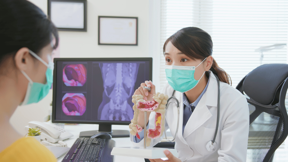 Summit Health doctor explaining colon cancer symptoms in women to a patient