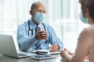 Doctor speaking with patient in office