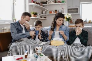 Family on couch with the flu