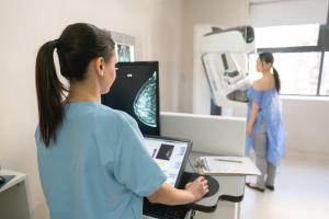 Summit Health physician performing mammogram on patient