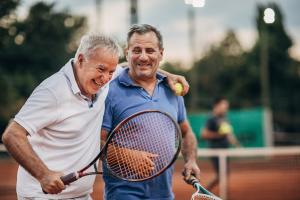 Two men playing tennis