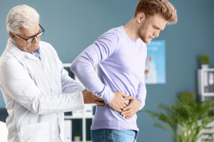 A nephrologist examining a patient’s kidneys for kidney diseases